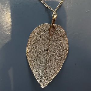 Gold feather pendant necklace